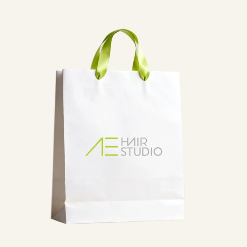 Custom ribbon handle eurotote with printed logo and lime green satin ribbon handles for salon packaging